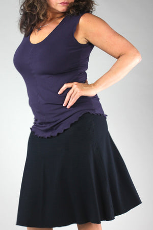 suger® flip skirt in black paired with indigo shell