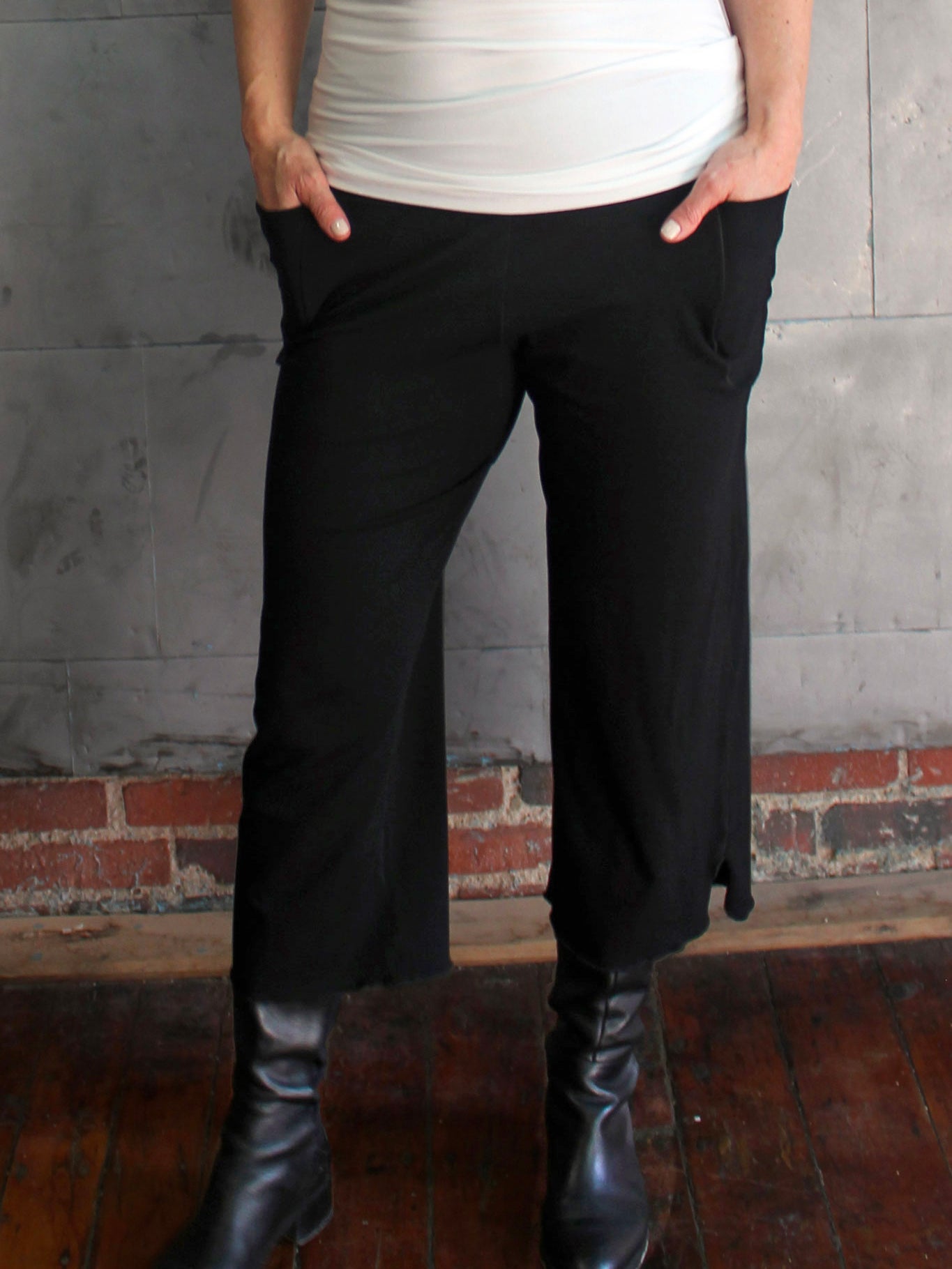 the black kick worn with a white wifey tank top