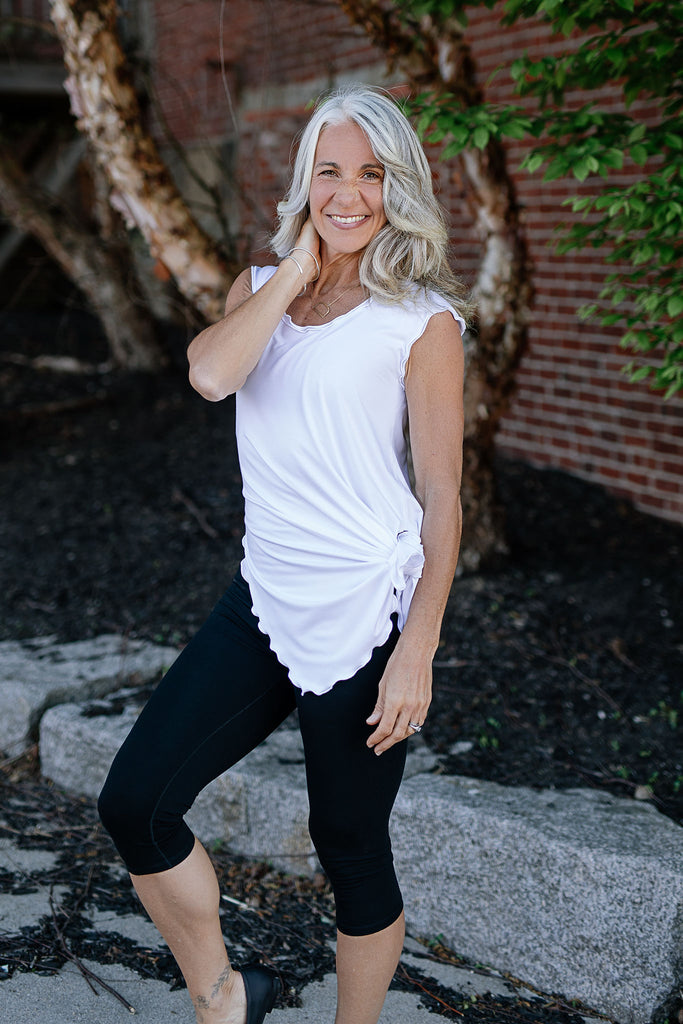 doublet in white paired with black capri