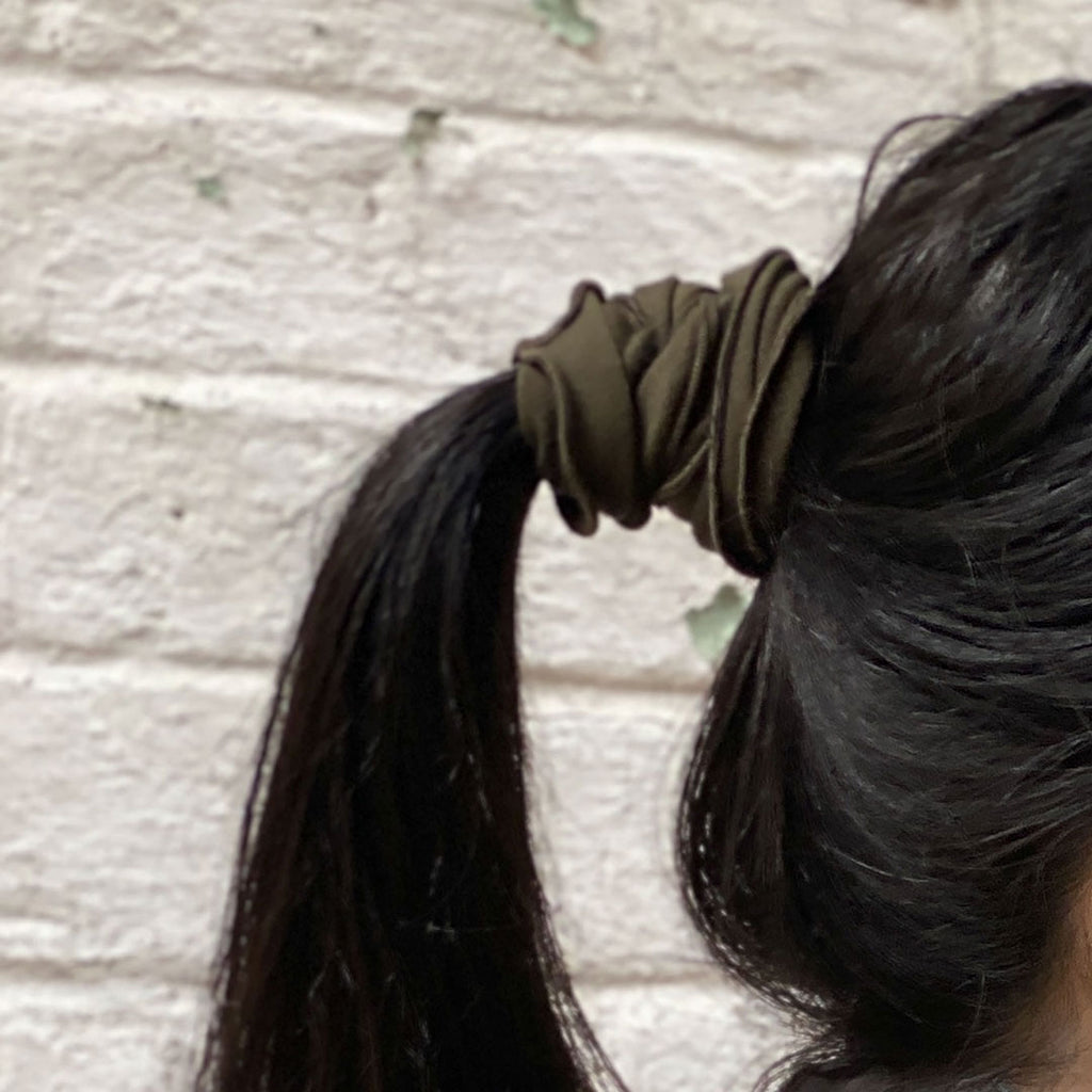 olive band holds ponytail securely
