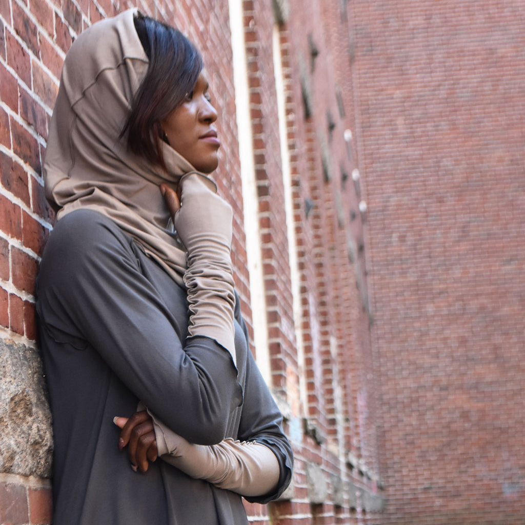 clay opera sleeves and hourglass hooded cowl are simply elegant paired with iron swing tunic