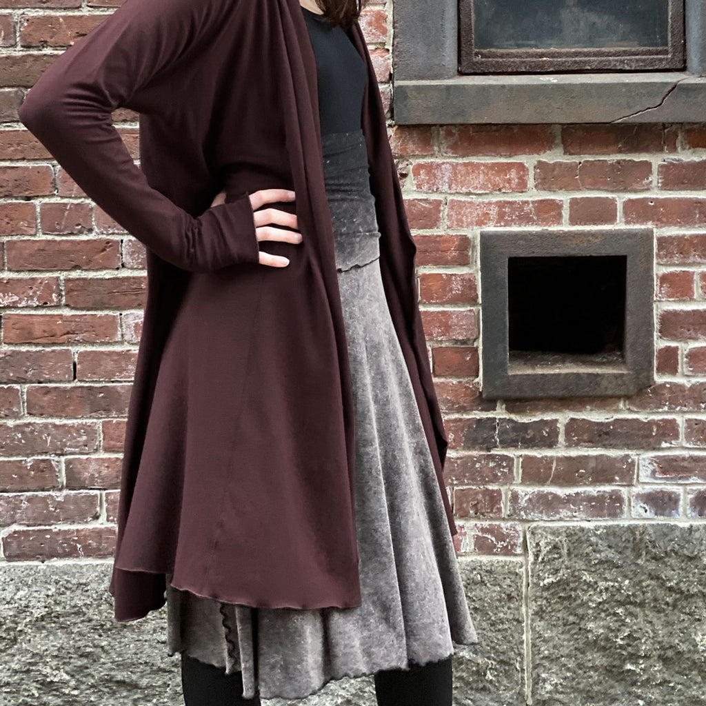 mineral lady flirt worn as skirt with black core tank + wine riding coat