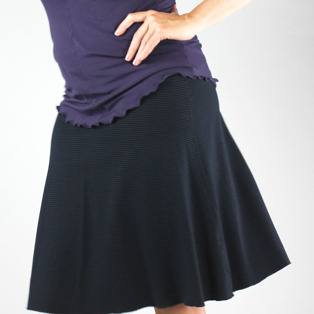 suger® flip skirt in subtle black styled with indigo shell