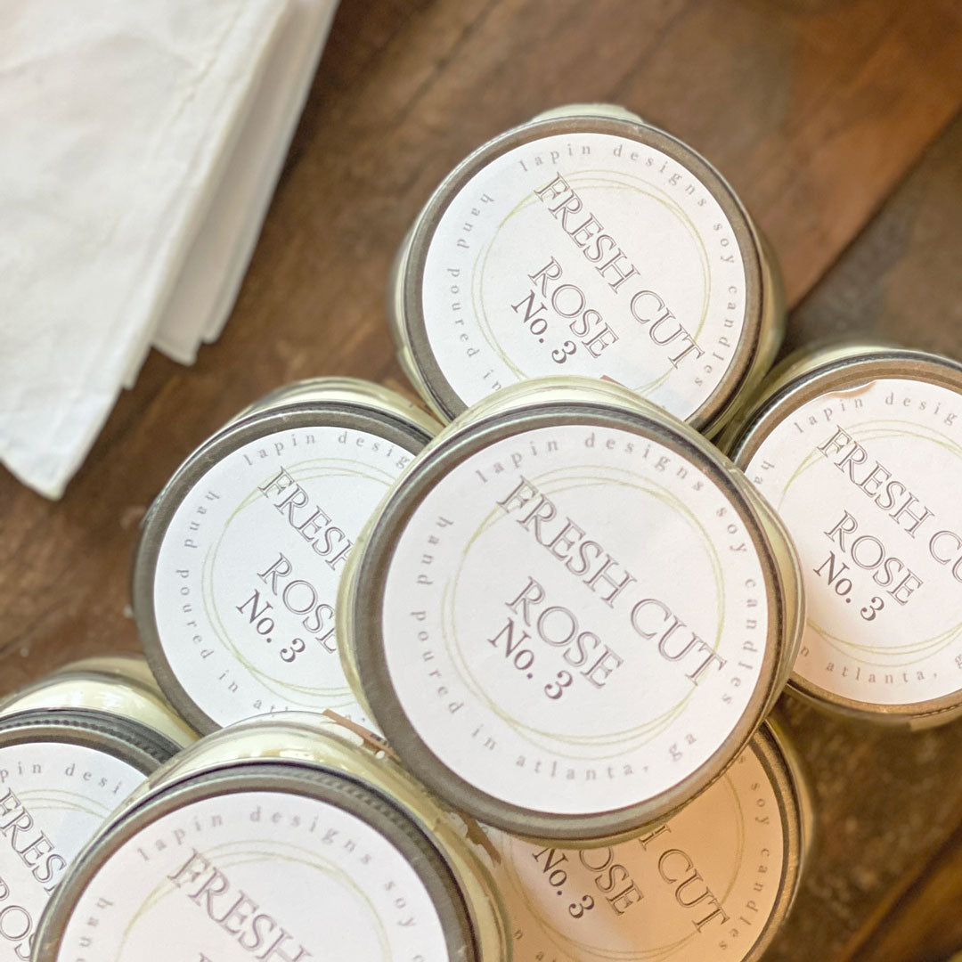 lapin soy candle in fresh cut rose