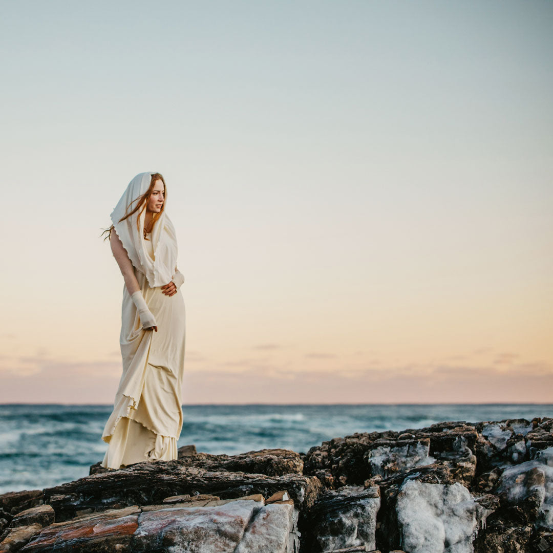 milk loop scarf shawl paired with milk aria sleeves over a milk glow gown